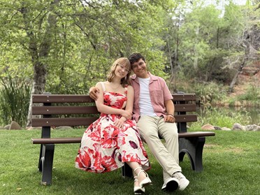 Kate and Noah, sitting on a bench